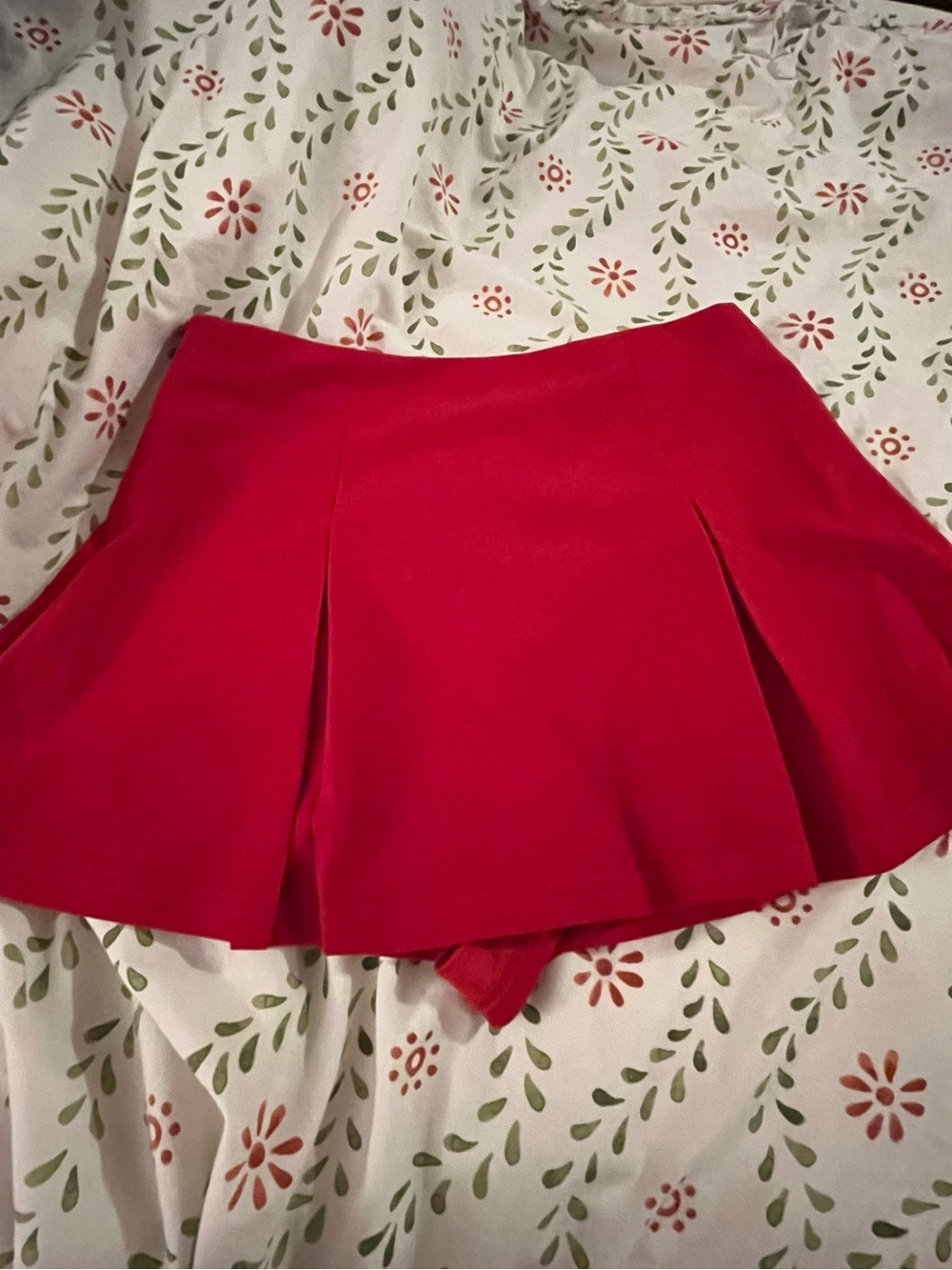 red pleated high rise mini skirt